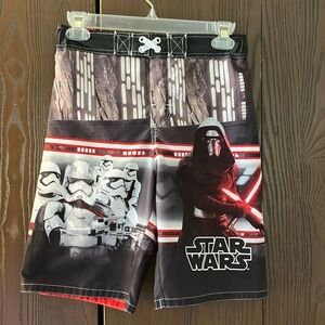 Star Wars boy’s black swim trunks with Star Wars characters. Size Large.